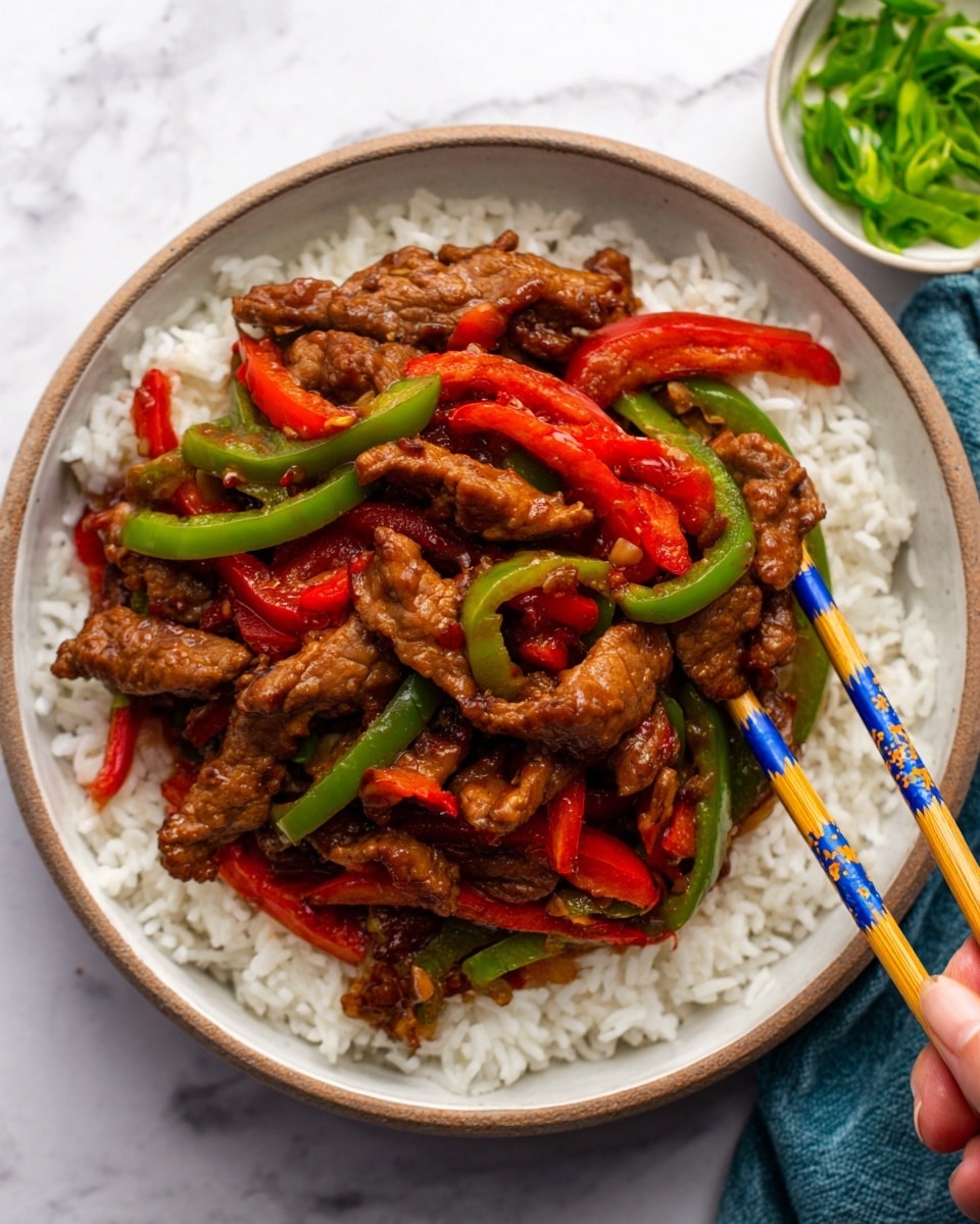 A white bowl with a blue rim holds a three-layered dish starting with a base of fluffy white rice, topped by sliced green and red bell peppers adding vibrant color, and finished with a glossy, dark brown stir-fried beef layer that looks tender and juicy. Light brown wooden chopsticks rest on the bowl’s edge. In the background, there are two small white bowls, one filled with sesame seeds and the other with green seaweed salad, set on a white marbled surface with a soft blue cloth nearby. Photo taken with an iphone --ar 4:5 --v 7