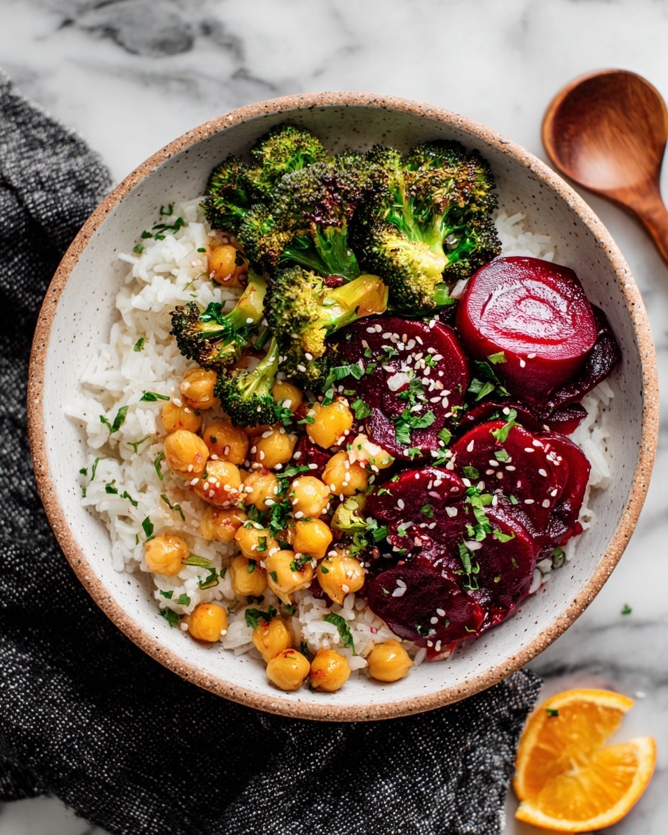 A white speckled bowl filled with three layers: the bottom layer is white rice, the middle layer has dark red beet slices arranged in a circle, and the top layer is a mix of roasted orange cubed vegetables and light brown chickpeas, sprinkled with sesame seeds and green herbs. On one side, bright green cooked broccoli sits on top of the rice. The bowl rests on a white marbled surface with a piece of an orange fruit visible in the top right corner and a dark cloth partially under the bowl. Photo taken with an iphone --ar 4:5 --v 7