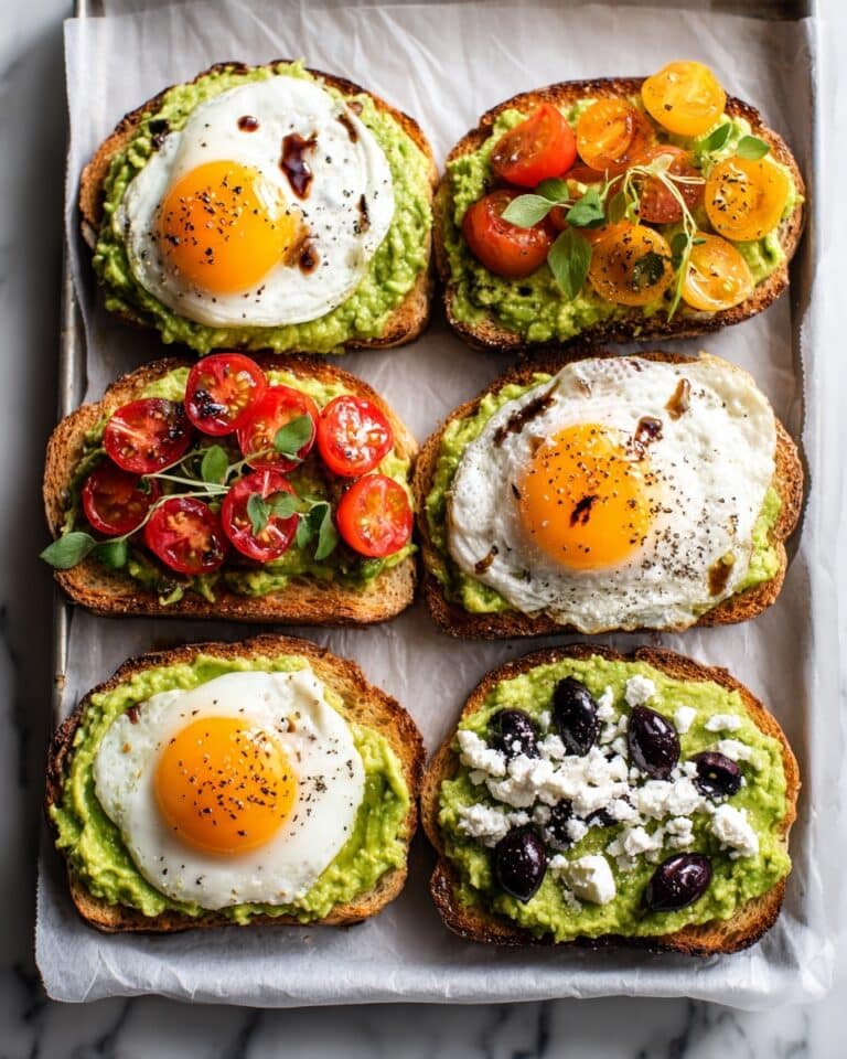 Avocado Toast with Eggs, Cherry Tomatoes, Feta, and Olives Recipe